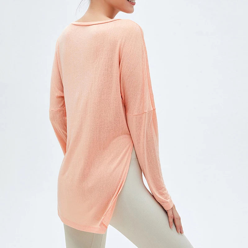 Women's Workout Tops with Side Slits in sweet orange for stylish comfort.