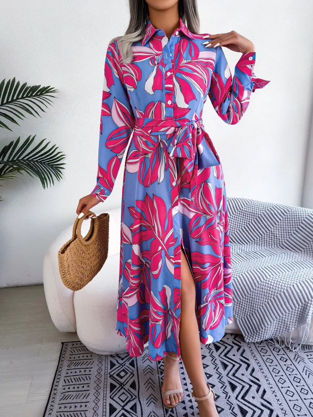 Model Showcasing Elegance in Pink Tropical Maxi Dress