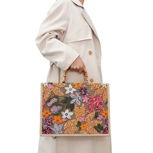 Model Embracing Vintage Elegance with Sequins Embroidered Woven Tote Bag