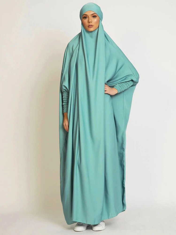 Jilbab Abaya draped elegantly, symbolizing sacred elegance.