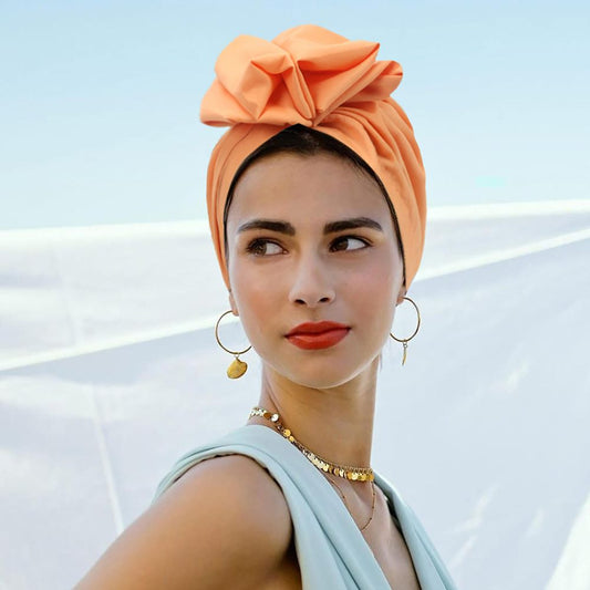 Model Embracing Effortless Elegance with Soft French Twist Turban Cap