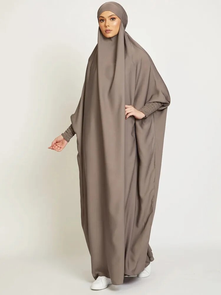 One-piece Jilbab Abaya in a serene solid color.